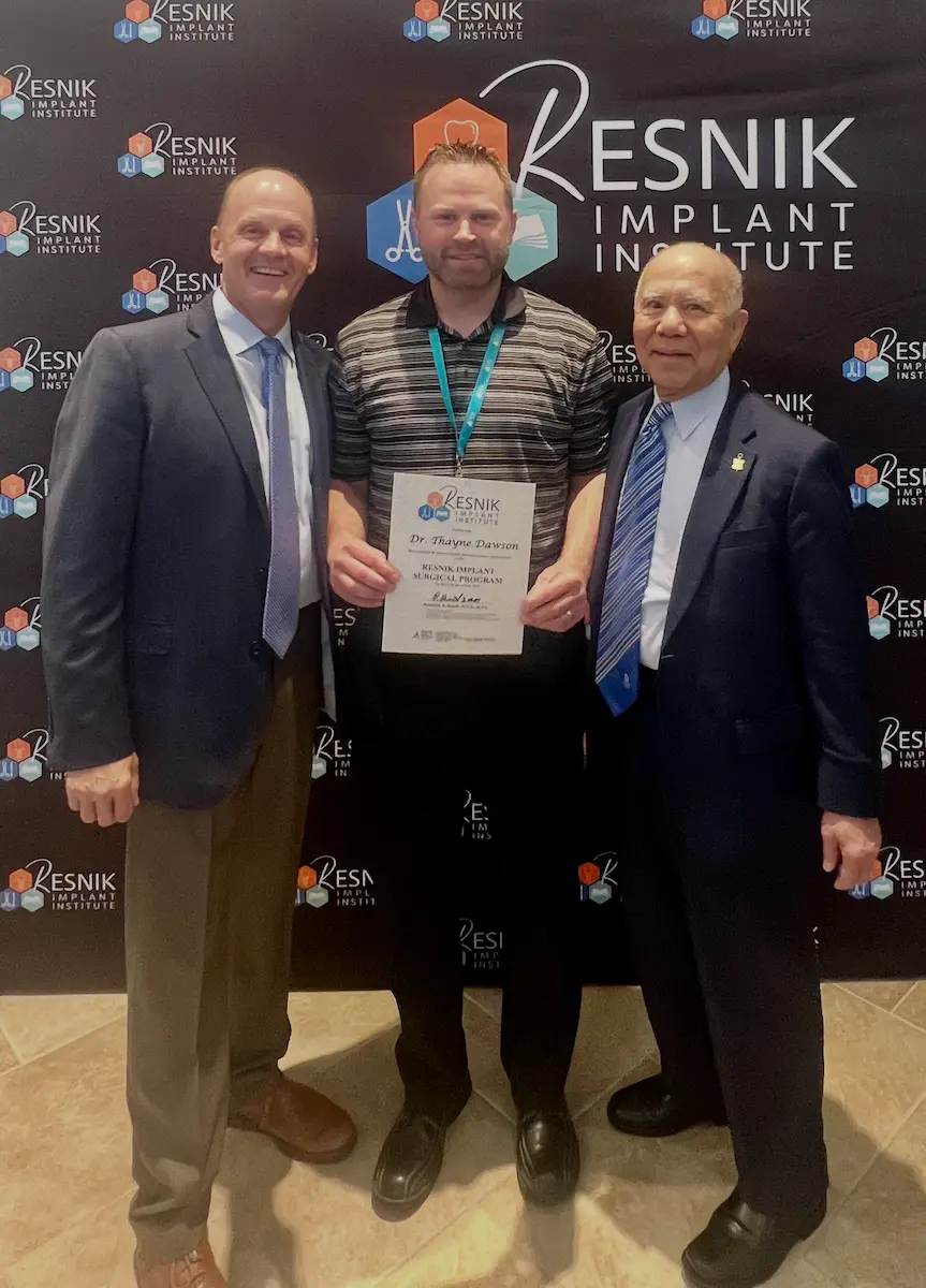 Dr. Dawson receiving from Resnik Implant Institute with Dr. Randy Resnik and Dr. Jon Suzuki