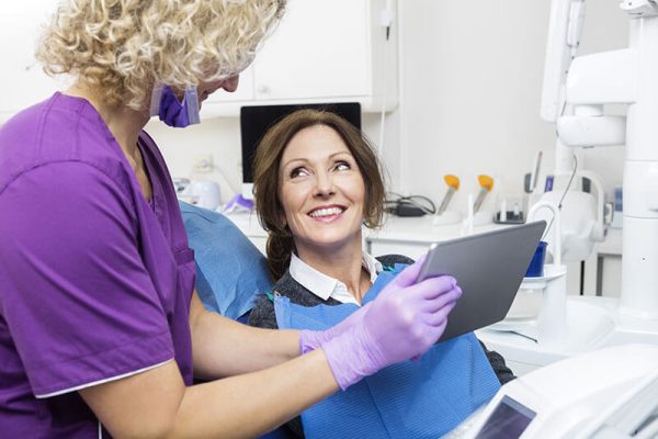 dentist explaining treatment to a patient